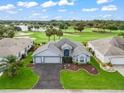 Gorgeous aerial view of home near golf course and other residences at 1706 Augustine Dr, The Villages, FL 32159