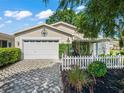 Charming home with well-maintained landscaping and a stone paver driveway at 17324 Se 82Nd Pecan Ter, The Villages, FL 32162