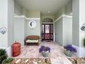 Welcoming entryway with brick floors, seating and front door with sidelights at 25222 Laurel Valley Rd, Leesburg, FL 34748
