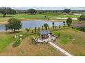 Expansive backyard featuring a gazebo, lush landscaping, and serene views of the golf course at 3097 Bureau Path, The Villages, FL 32163