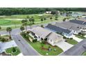 Aerial view of home on corner lot with well-maintained landscaping and golf course view at 3466 Smedley Rd, The Villages, FL 32163