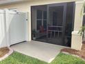 A screened patio with a privacy fence offers a relaxing outdoor space with comfortable seating and a view of the yard at 3466 Smedley Rd, The Villages, FL 32163