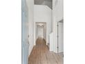 Welcoming entryway featuring wood-look tile floors leading to the living spaces with neutral paint at 5107 Marshelder St, Apopka, FL 32712