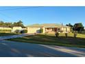 Well-maintained home with an attached garage, a quaint screened porch, and a beautifully landscaped front yard at 8850 Se 156Th St, Summerfield, FL 34491