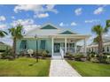 Inviting single-Gathering home with a lovely front porch, complemented by vibrant landscaping and a paved walkway at 1057 Sugarloaf Key Loop, Lady Lake, FL 32159