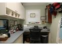 Functional office space with built-in cabinets, desk area, and natural light at 1553 Lynchburg Loop, The Villages, FL 32162