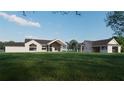 A large modern home with a spacious lawn, an attached carport, and expansive windows, ideal for entertaining at 2421 Shady Ln, Groveland, FL 34736