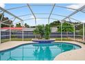 Inviting pool with blue tile and a serene setting, perfect for relaxation and backyard enjoyment at 2705 Bayview Dr, Eustis, FL 32726