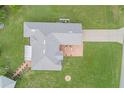 Aerial view of house highlighting roof and expansive yard with outbuilding at 316 Dupont Cir, Howey In The Hills, FL 34737