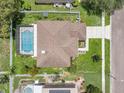 Overhead view of home with a screened pool and well-maintained landscaping at 1109 Needlewood Loop, Oviedo, FL 32765