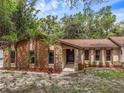Lovely single-story home with stone accents, a covered entry, and tasteful landscaping at 161 Cindy Ct, Lake Mary, FL 32746