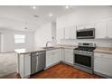 Bright kitchen with stainless steel appliances and stylish countertops at 1964 Rhett Rd, The Villages, FL 32163
