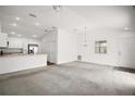 Open floor plan featuring new carpet, fresh paint and a view into the kitchen at 1964 Rhett Rd, The Villages, FL 32163
