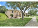 Inviting home exterior with well-kept lawn and mature trees, offering great curb appeal at 2745 Shearwater St, Clermont, FL 34711