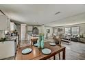 Spacious open-concept living space with modern flooring, updated appliances, and cozy furnishings at 892 Se 124Th Ave, Webster, FL 33597