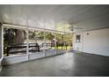 Spacious screened patio with ceiling fan, offering a view of the deck and backyard at 1301 Cambridge Dr, Leesburg, FL 34748