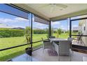 Covered patio space with a ceiling fan and views of the backyard at 1721 Germakian Ln, The Villages, FL 32163