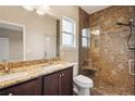 Beautiful bathroom featuring a double sink vanity and glass enclosed tile shower with built in bench at 2495 Se 75Th Blvd, Bushnell, FL 33513