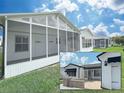 This home includes a delightful screened patio, perfect for outdoor relaxation and enjoying the surrounding views at 3237 Atwell Ave, The Villages, FL 32162
