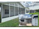 A bright and airy screened-in porch provides seamless indoor-outdoor living and picturesque neighborhood views at 3237 Atwell Ave, The Villages, FL 32162