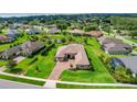 Aerial view showcases this home's location with mature landscaping and inviting curb appeal at 6008 Apex Way, Lady Lake, FL 32159