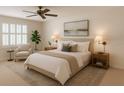 Bright bedroom featuring a ceiling fan, neutral tones, and comfortable furnishings at 724 Rosemere Cir, Orlando, FL 32835