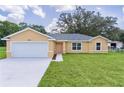 Beautiful single-Gathering home with well-maintained landscaping, a two-car garage, and excellent curb appeal at 14631 Se 95Th Ct, Summerfield, FL 34491