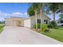 Home showcasing carport and driveway leading to the charming residence at 1815 Kaufman Cir, Lady Lake, FL 32159