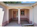 Inviting front porch featuring a charming front door and classic architectural details at 206 Palermo Pl, Lady Lake, FL 32159