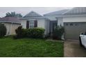 Inviting single-Gathering home with a well-manicured lawn and a two-car garage at 222 Bacopa Pass, Davenport, FL 33897