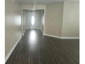 Bright living room featuring wood floors and a modern open concept design at 222 Bacopa Pass, Davenport, FL 33897