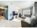 Inviting living room with tile flooring, modern furniture, and plenty of natural light at 326 N Lancelot Ave, Orlando, FL 32835