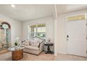 Bright living room with neutral décor, comfortable seating, and lots of natural light at 5386 Pine Lilly Dr, St Cloud, FL 34771