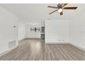 Bright living room featuring sleek wood-look floors and neutral walls at 5390 Nw 12Th Pl, Ocala, FL 34482