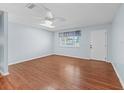 Cozy bedroom featuring a ceiling fan, window with blinds, and ample natural light at 10161 Sw 87Th Ter, Ocala, FL 34481
