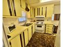 A functional kitchen with ample cabinet space and essential appliances at 112 Caladium St, Leesburg, FL 34748