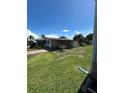 Spacious lawn of charming home with beautiful backyard, great for activities at 1404 Plantation Dr # 9, Lady Lake, FL 32159
