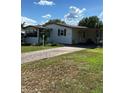 Charming one story home with inviting driveway and landscaping at 1404 Plantation Dr # 9, Lady Lake, FL 32159