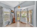 Bright dining area features large windows with decorative curtains and a charming built-in cabinet at 1906 Chathamoor Dr, Orlando, FL 32835