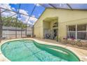 Inviting screened-in pool area featuring a spacious patio, serene atmosphere and seamless indoor-outdoor living at 1906 Chathamoor Dr, Orlando, FL 32835