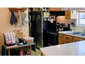 Compact kitchen featuring stainless steel appliances and ample counter space at 235 Rockmoore Ct, Deland, FL 32720