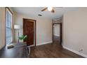 Bedroom featuring hardwood floors, a ceiling fan and lots of natural light at 256 Carroll St, Clermont, FL 34711
