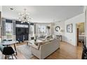 Well-lit living room boasting hardwood floors, modern décor, and a sliding glass door at 2639 Maitland Crossing Way # 102, Orlando, FL 32810