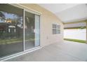 A covered patio with screen door provides access to the spacious backyard, offering relaxation and outdoor enjoyment at 33234 Kaylee Way, Leesburg, FL 34788