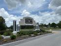 An entrance sign to Marco Polo Village, a deed-restricted 55+ community at 5268 Sw 110Th Pl, Ocala, FL 34476