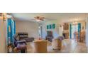 Inviting living room with tile floors and ample natural light, creating a comfortable and airy space at 7211 Se 120Th St, Belleview, FL 34420