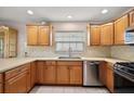 Bright kitchen with stainless steel appliances, tiled backsplash, and solid surface countertops at 953 Mayo Ct, The Villages, FL 32162
