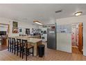 Spacious eat-in kitchen with an island, wood cabinets, and modern appliances at 1048 Cr 452A, Lake Panasoffkee, FL 33538