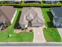 Beautiful aerial view of the property, showcasing the home's layout, landscaping, and surrounding neighborhood at 10927 Se 168Th Loop, Summerfield, FL 34491