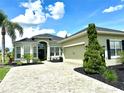 Attractive single-story home with a paver driveway and two-car garage at 12183 Se 178Th St, Summerfield, FL 34491
